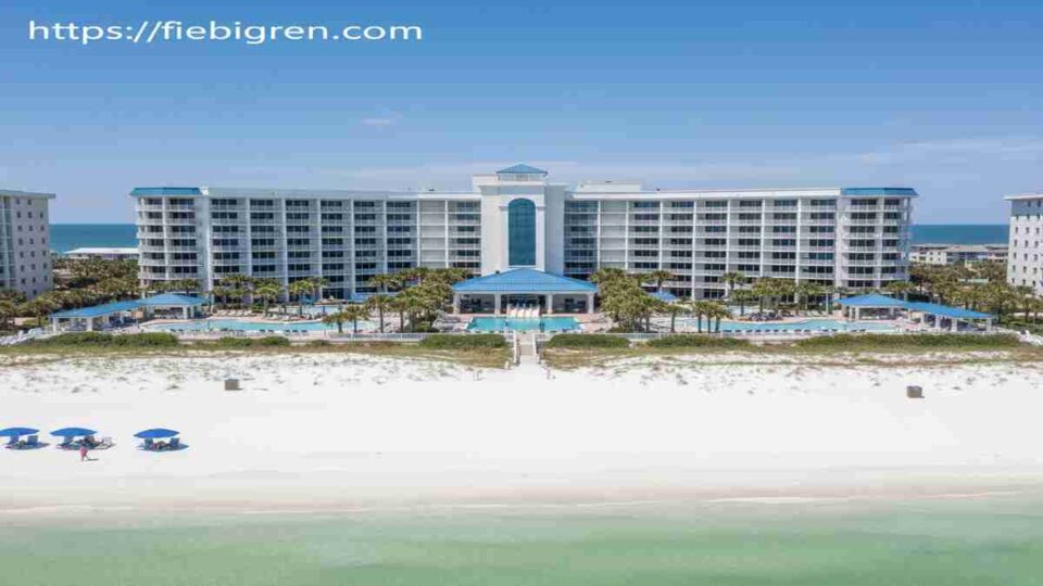Luxury beachfront condos at Mainsail Resort Miramar Beach Florida with white sand and Gulf views under a sunny sky.